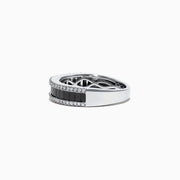The 14K White Gold Black and White Diamond Band Ring, 1.06 TCW, showcases a row of rectangular black diamonds framed by two rows of round white diamonds on a sleek white gold band.