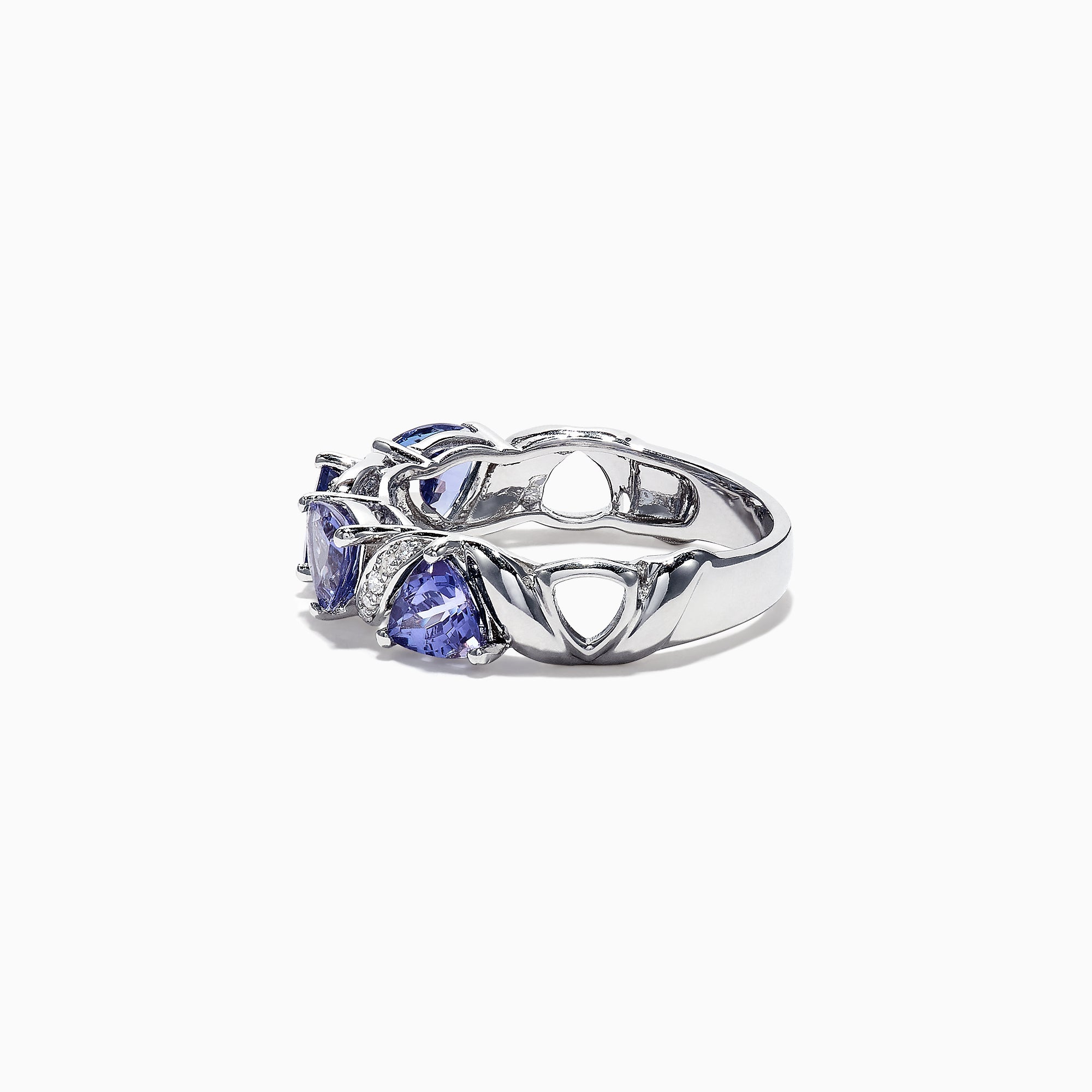 The Nahla Siri 14K White Gold Tanzanite Diamond Ring, 1.58 TCW, features three heart-shaped blue tanzanites set among wavy silver and diamond accents, shown on a white background.