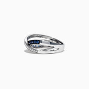 The Royale Bleu 14K White Gold Blue Sapphire and Diamond Ring, 0.39 TCW, showcases an elegant crisscross design with a row of sparkling white diamonds and deep blue sapphires set in overlapping bands.