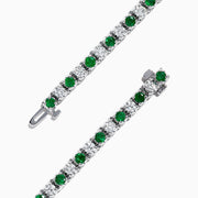 The Brasilica 14K White Gold Emerald and Diamond Tennis Bracelet, 4.78 TCW, showcases alternating emeralds and diamonds, set in polished white gold, displayed on a white background.