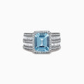 The Aquarius 14K White Gold Diamond and Aquamarine Ring showcases a large rectangular light blue aquamarine center stone, accented by multiple rows of clear baguette and round-cut diamonds along the band.