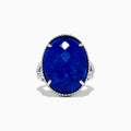 The 925 Sterling Silver Lapis Lazuli Cocktail Ring, 13.85 TCW, features a large faceted oval lapis lazuli gemstone in an ornate prong setting, showcased against a white background.