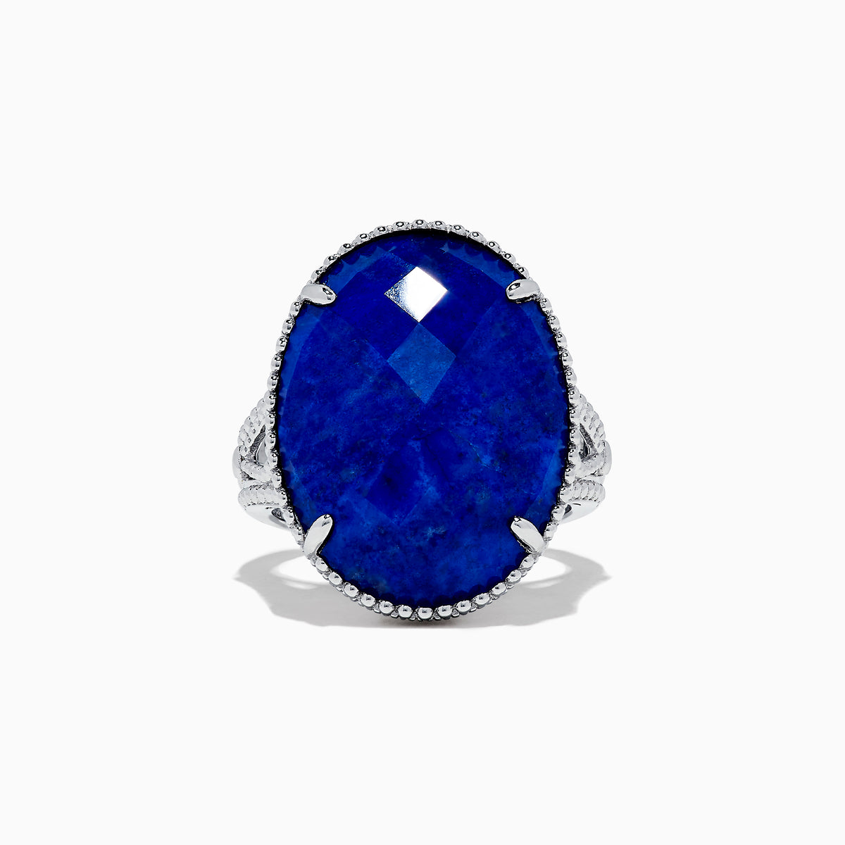 The 925 Sterling Silver Lapis Lazuli Cocktail Ring, 13.85 TCW, features a large faceted oval lapis lazuli gemstone in an ornate prong setting, showcased against a white background.