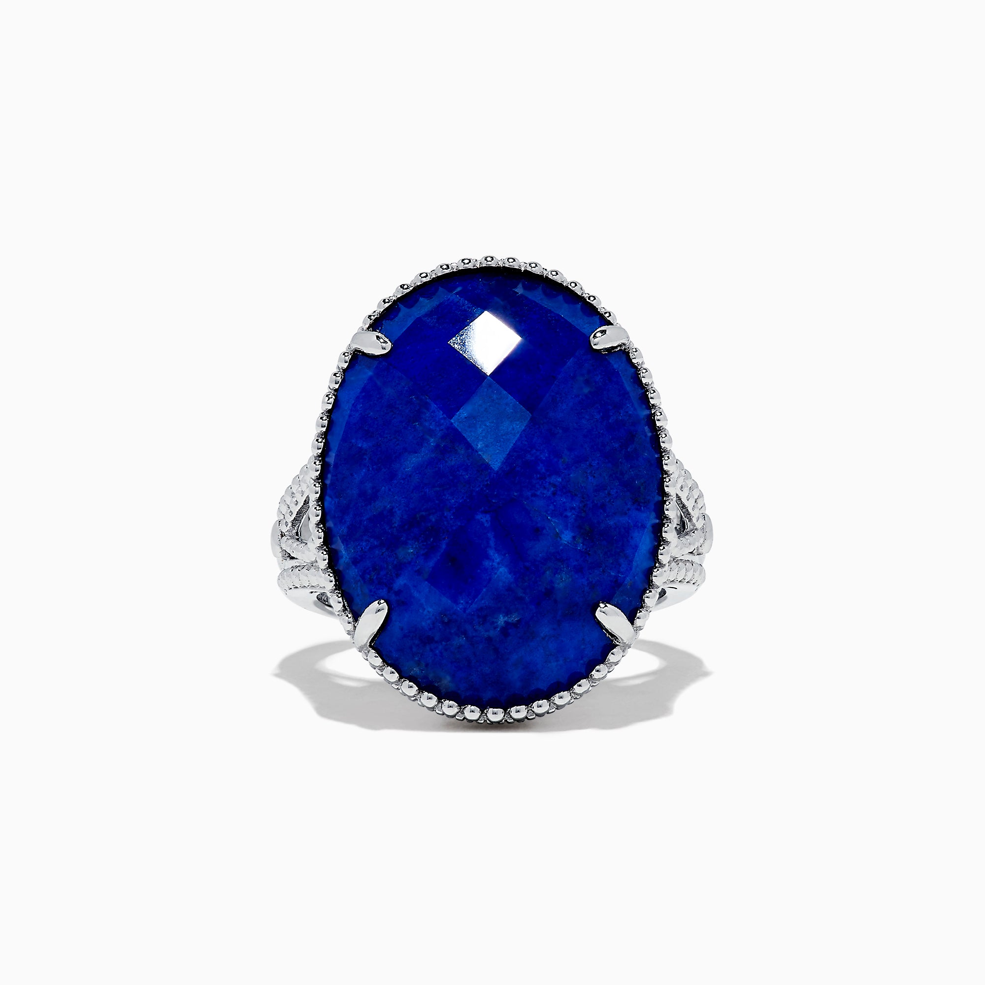 The 925 Sterling Silver Lapis Lazuli Cocktail Ring, 13.85 TCW, features a large faceted oval lapis lazuli gemstone in an ornate prong setting, showcased against a white background.