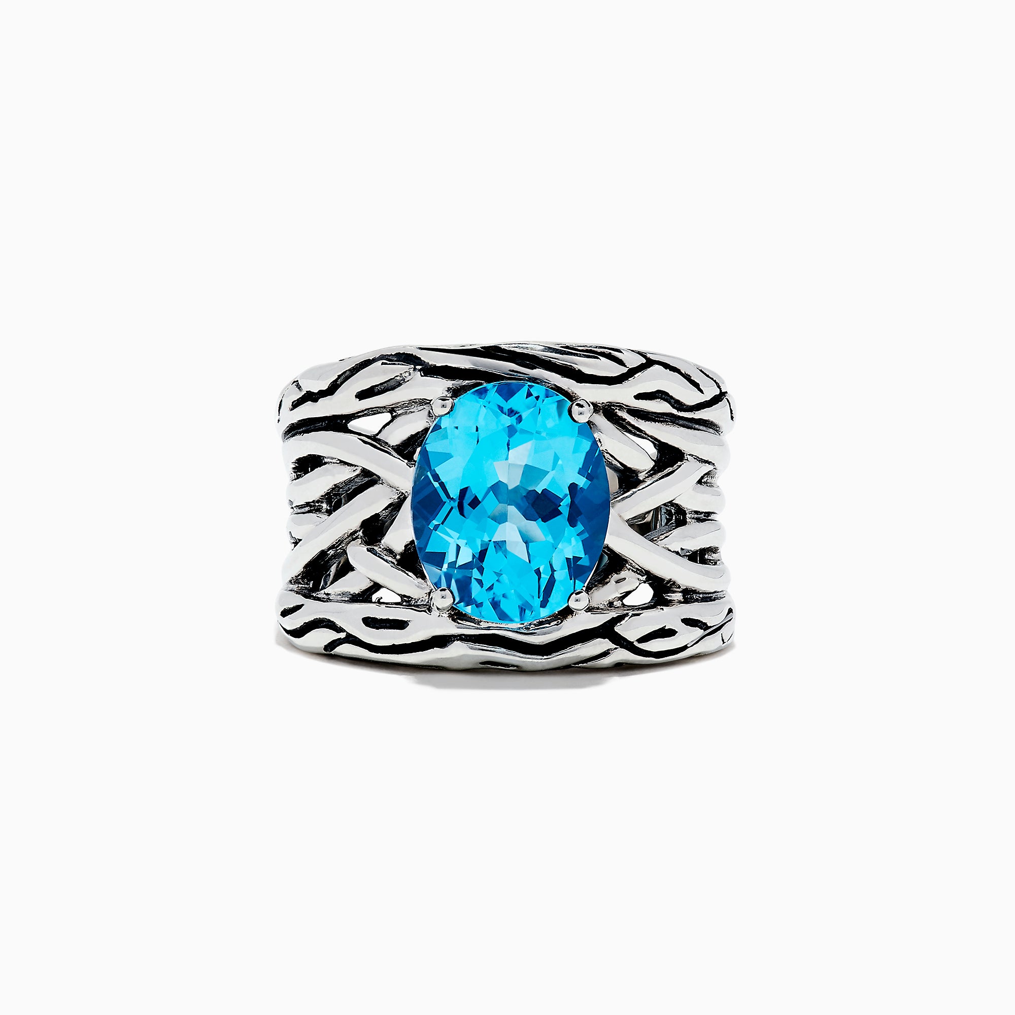 The 925 Lagoon Sterling Silver Blue Topaz Ring, 5.70 TCW features a wide band with a textured wavy design and a large oval blue topaz centerpiece—an elegant statement piece.