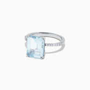 The Aquarius 14K White Gold Aquamarine and Diamond Ring (3.96 TCW) showcases a large rectangular aquamarine center stone, accented by small white diamonds along its slim white gold band.