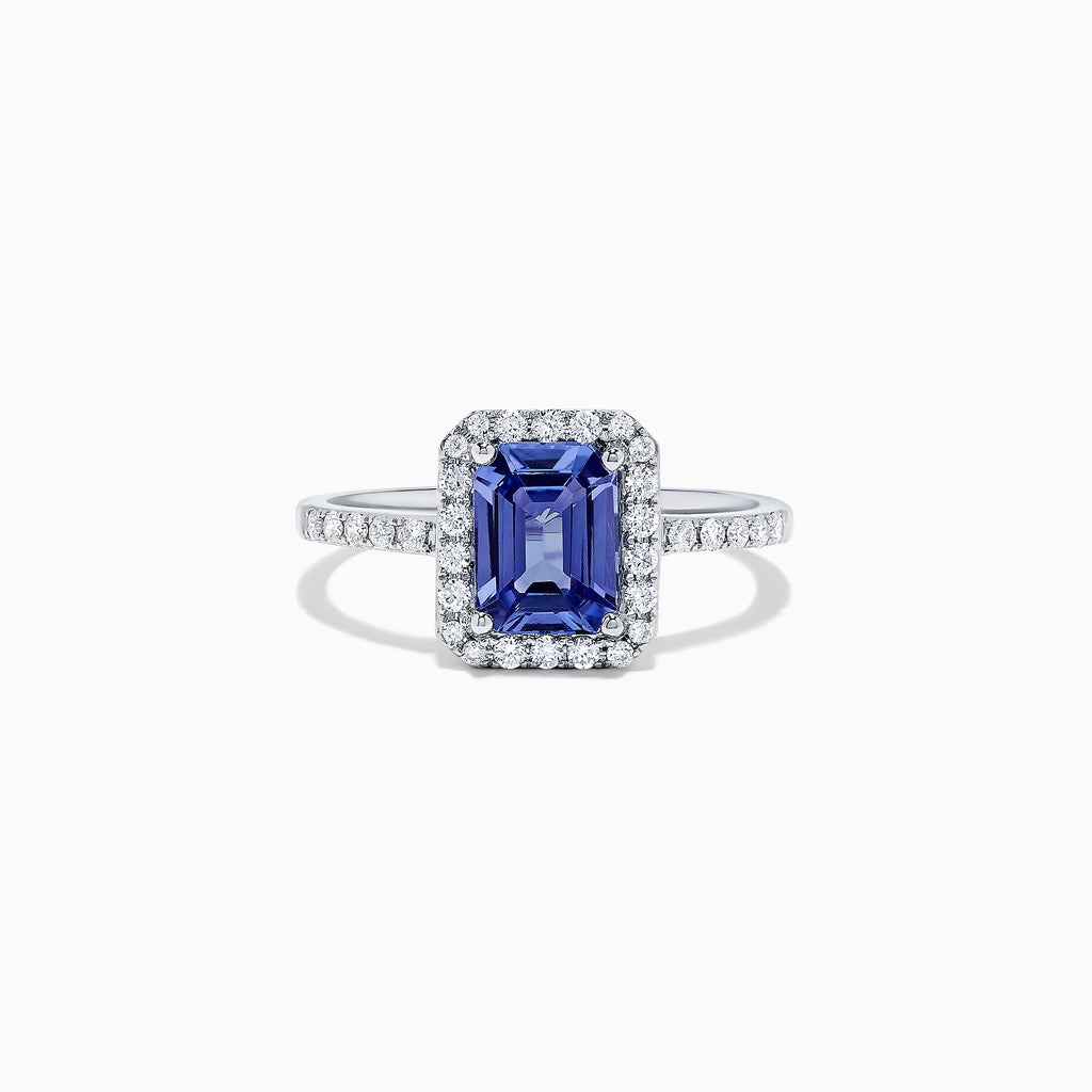 The Nahla Siri 14K White Gold Tanzanite and Diamond Ring, 1.60 TCW, showcases an emerald-cut tanzanite center framed by a halo of diamonds and additional diamonds along the band.
