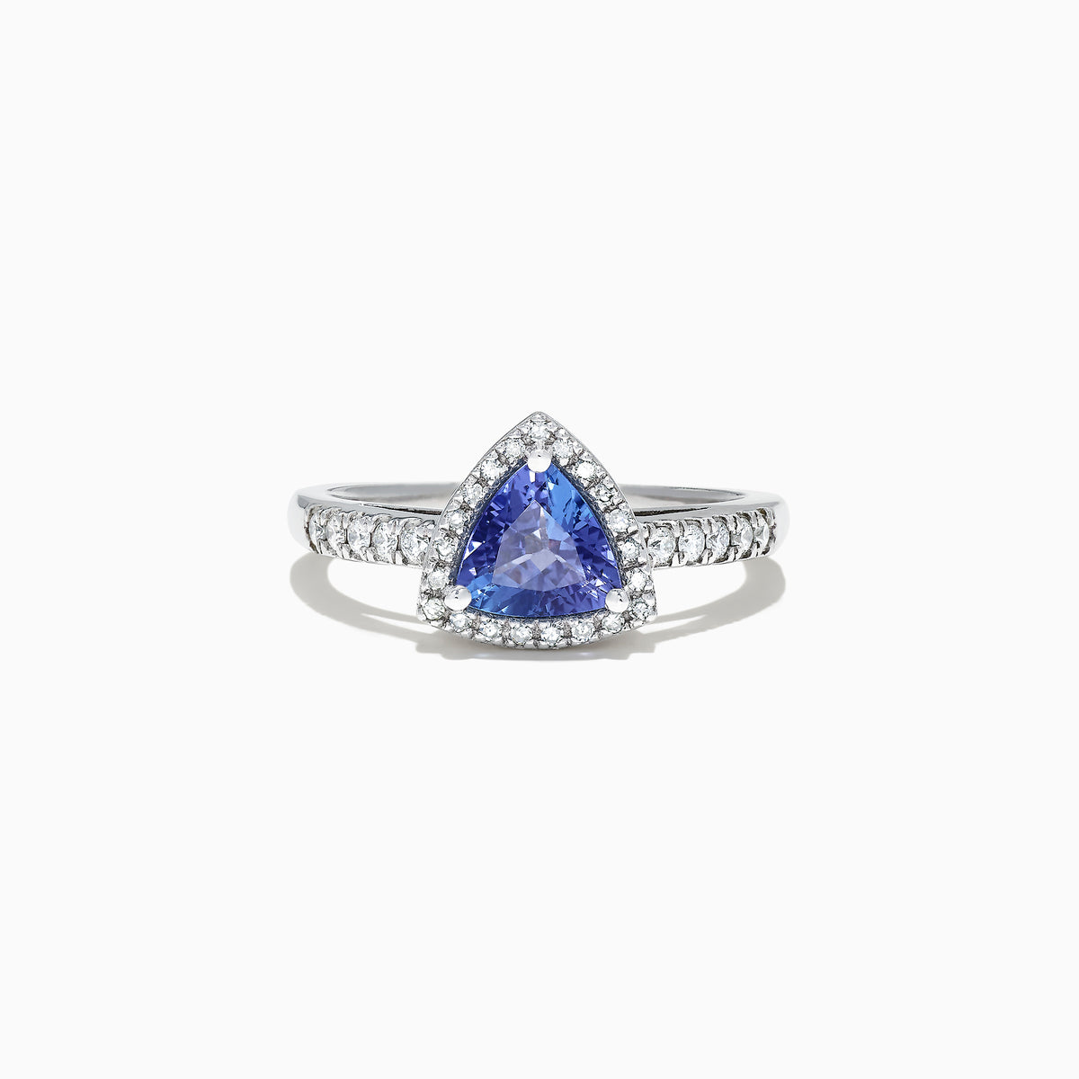 The Nahla Siri 14K White Gold Trillion Tanzanite and Diamond Ring, 0.96 TCW, showcases a triangular blue tanzanite center with a halo and band of sparkling white diamonds, presented on a white background.