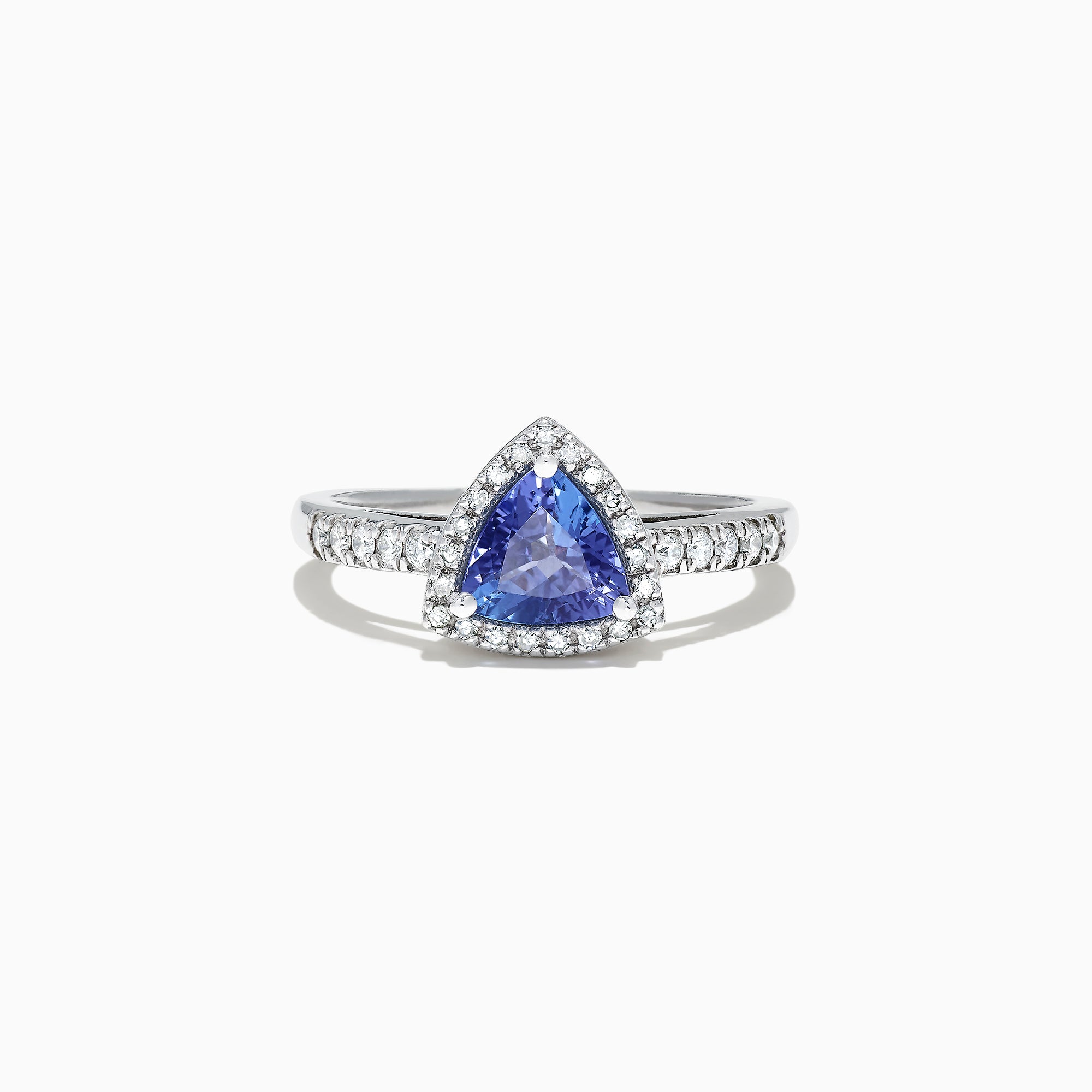 The Nahla Siri 14K White Gold Trillion Tanzanite and Diamond Ring, 0.96 TCW, showcases a triangular blue tanzanite center with a halo and band of sparkling white diamonds, presented on a white background.