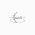 The Novelty 14K White Gold Moon and Star Diamond Ring, 0.08 TCW, features a crescent moon with diamonds on one side and a diamond-studded star on the other, beautifully set in white gold.