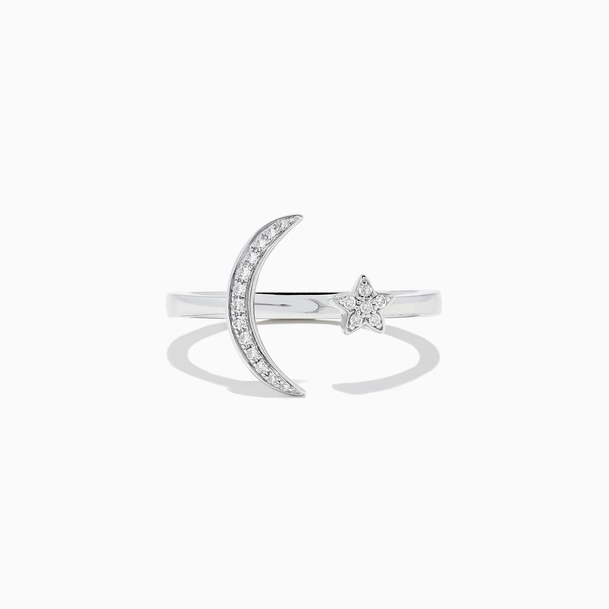 The Novelty 14K White Gold Moon and Star Diamond Ring, 0.08 TCW, features a crescent moon with diamonds on one side and a diamond-studded star on the other, beautifully set in white gold.