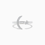 The Novelty 14K White Gold Moon and Star Diamond Ring, 0.08 TCW, features a crescent moon with diamonds on one side and a diamond-studded star on the other, beautifully set in white gold.