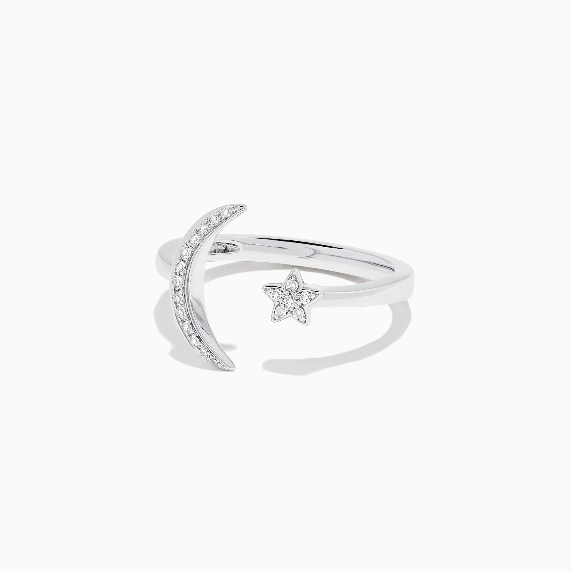 The Novelty 14K White Gold Moon and Star Diamond Ring, 0.08 TCW, features a crescent moon with diamonds on one side and a diamond-studded star on the other, beautifully set in white gold.