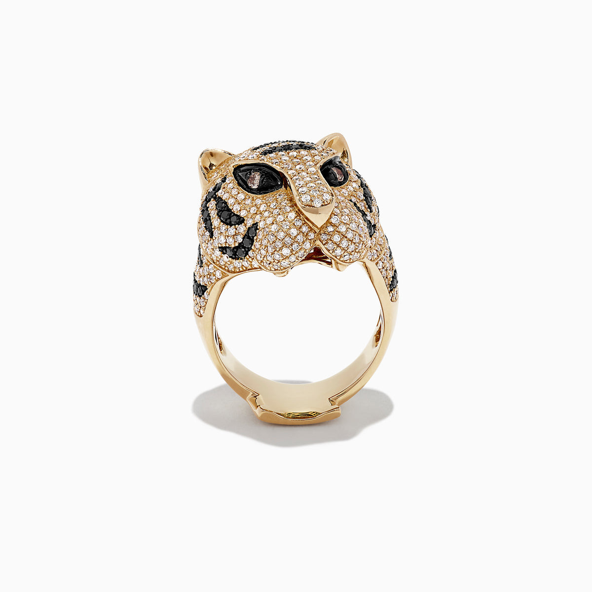 The Safari 14k Yellow Gold Black and White Diamond Tiger Ring (1.85 TCW) showcases a tiger’s head in yellow gold, detailed with black and white diamonds for the eyes and stripes, set on a white backdrop.