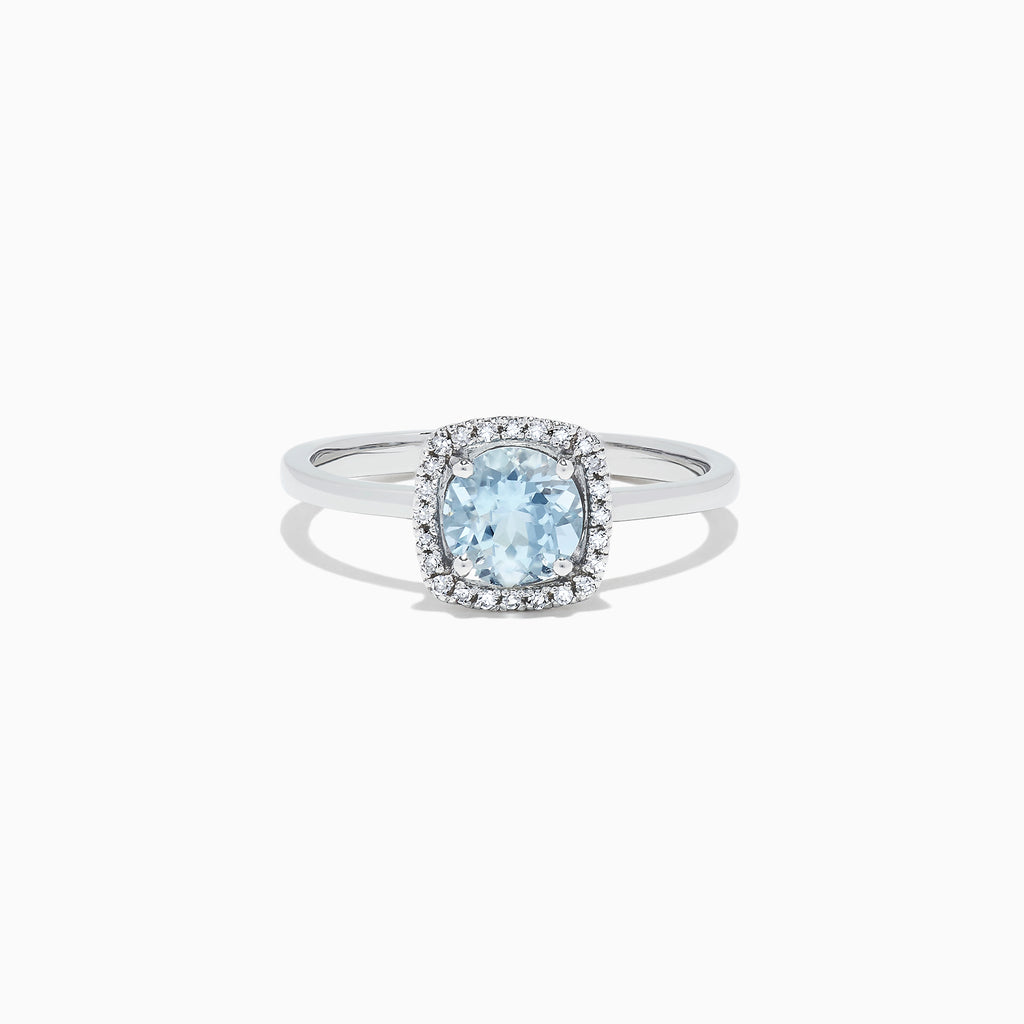 The Aquarius 14K White Gold Aquamarine and Diamond Ring, 0.78 TCW, features a cushion-cut aquamarine center with a diamond halo, shown on a white background.