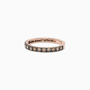 The 14K Rose Gold Brown Diamond Stacking Ring, 0.65 TCW, showcases a full circle of round brown diamonds in a channel setting, perfect for stacking and shown against a white backdrop.
