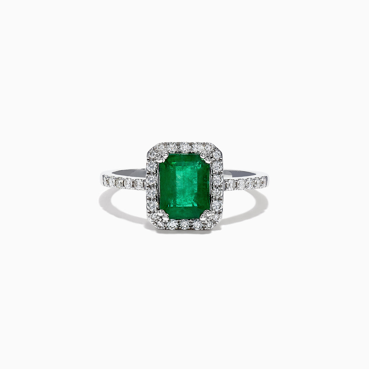 The Brasilica 14K White Gold Emerald and Diamond Ring, 1.69 TCW, features a rectangular green emerald center stone with a halo of round diamonds and additional diamonds on the band, shown against a white background.