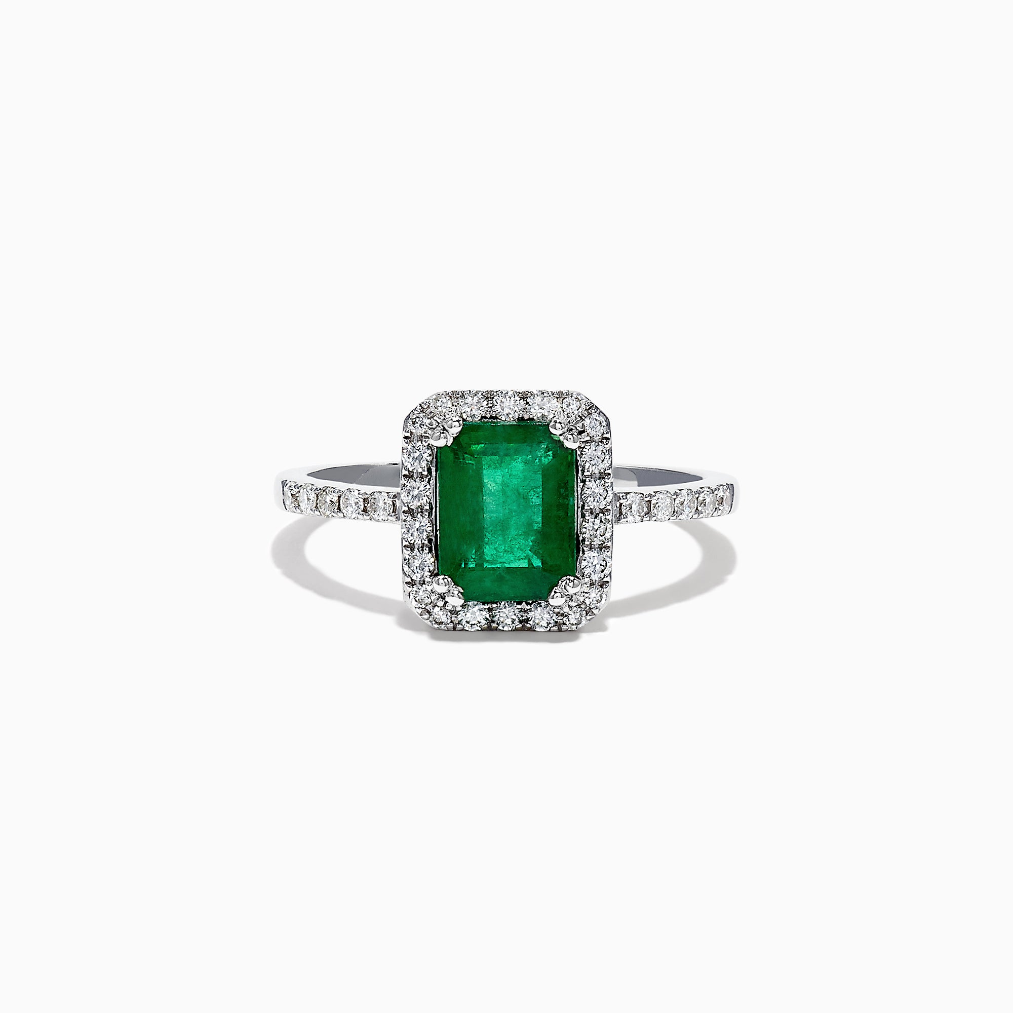 The Brasilica 14K White Gold Emerald and Diamond Ring, 1.69 TCW, features a rectangular green emerald center stone with a halo of round diamonds and additional diamonds on the band, shown against a white background.