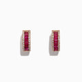 The Ruby Royale 14K Rose Gold Baguette Cut Ruby Hoop Earrings (1.90 TCW) feature red baguette rubies bordered by two rows of white diamonds, shown on a white background.