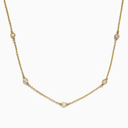 The DOro 14K Yellow Gold 18 Diamond Station Necklace (0.21 TCW) features five round bezel-set diamonds spaced along the front and is shown on a white background.