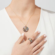 The Watercolors 14K Yellow Gold Multi Sapphire & Diamond Pendant (5.71 TCW) features an intricate round design with sapphires and diamonds in abstract floral and leaf patterns, set on a classic gold chain.