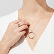 The Trio 14K Tri-Color Gold Diamond Accented Crossover Ring, 0.11 TCW, features intertwined yellow, white, and rose gold bands with a sparkling diamond-accented band for added brilliance.