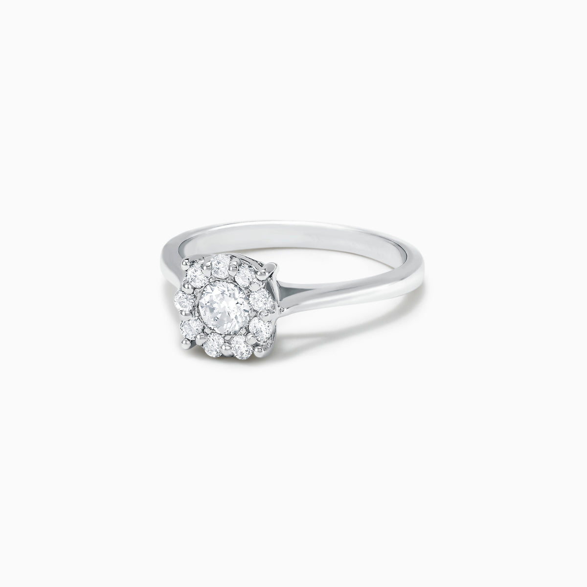 The Bouquet 14K White Gold Diamond Cluster Ring, 0.51 TCW, showcases a brilliant round center diamond framed by a halo of smaller diamonds, beautifully presented against a plain white background.