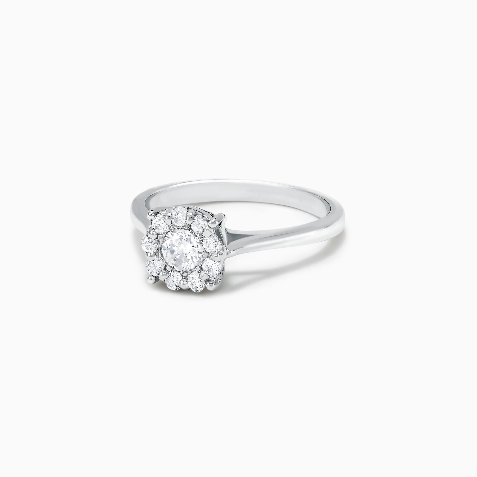 The Bouquet 14K White Gold Diamond Cluster Ring, 0.51 TCW, showcases a brilliant round center diamond framed by a halo of smaller diamonds, beautifully presented against a plain white background.