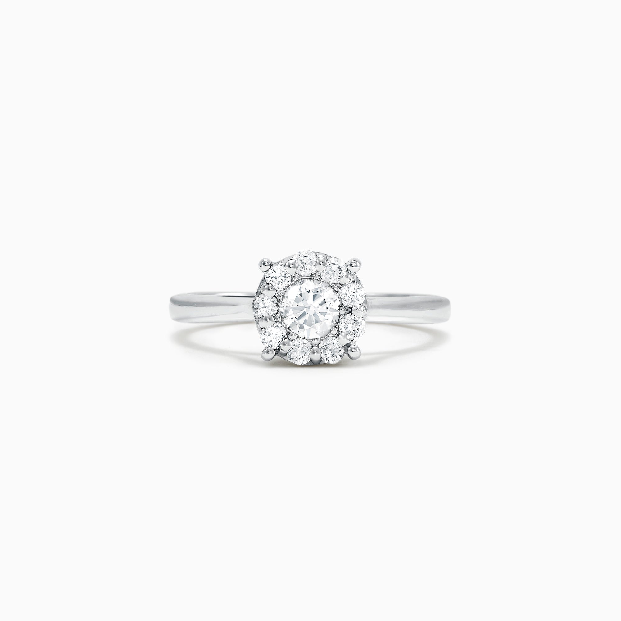 The Bouquet 14K White Gold Diamond Cluster Ring, 0.51 TCW, showcases a brilliant round center diamond framed by a halo of smaller diamonds, beautifully presented against a plain white background.