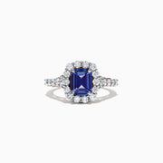 The Nahla Siri 14K Two Tone Gold Emerald Cut Tanzanite and Diamond Ring, 2.32 TCW, showcases a halo of round white diamonds on a diamond-encrusted band, set against a white background.