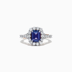 The Nahla Siri 14K Two Tone Gold Emerald Cut Tanzanite and Diamond Ring, 2.32 TCW, showcases a halo of round white diamonds on a diamond-encrusted band, set against a white background.