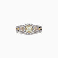 The Canare 14K Two-Tone Gold Cushion Shaped Cluster Yellow Diamond Ring showcases a yellow diamond center with a halo of white diamonds and a split shank band, creating a dazzling cluster effect.