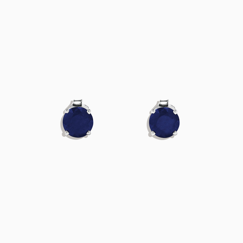 The Royale Bleu 14K White Gold Sapphire Stud Earrings, 2.00 TCW, feature round deep blue stones set in white gold prongs, displayed against a plain white background.