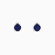 The Royale Bleu 14K White Gold Sapphire Stud Earrings, 2.00 TCW, feature round deep blue stones set in white gold prongs, displayed against a plain white background.
