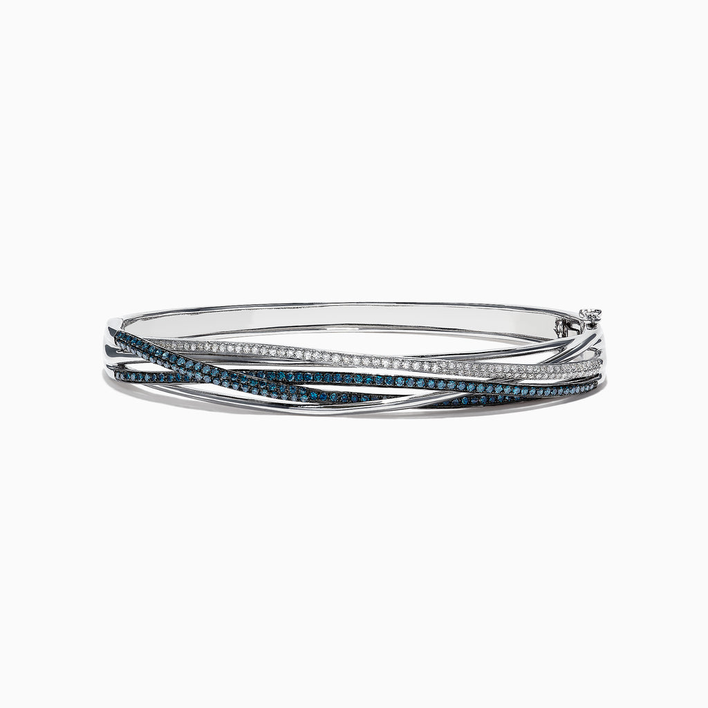 The Bella Bleu 14K White Gold Blue and White Diamond Bangle features intertwining bands set with blue and white diamonds (1.17 TCW) in a sophisticated, layered design.