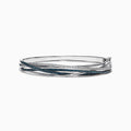 The Bella Bleu 14K White Gold Blue and White Diamond Bangle features intertwining bands set with blue and white diamonds (1.17 TCW) in a sophisticated, layered design.