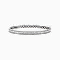 The Classique 14K White Gold Diamond Bangle 1.22 TCW features two rows of round diamonds, a central row of vertically set baguette-cut diamonds, and an openwork inner band design.