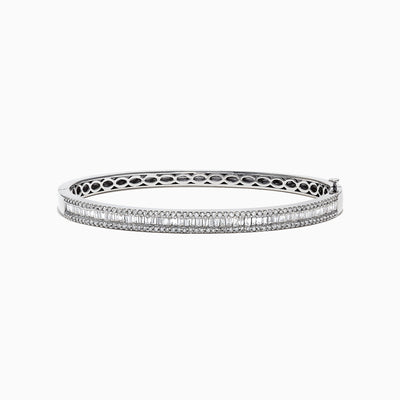 The Classique 14K White Gold Diamond Bangle 1.22 TCW features two rows of round diamonds, a central row of vertically set baguette-cut diamonds, and an openwork inner band design.