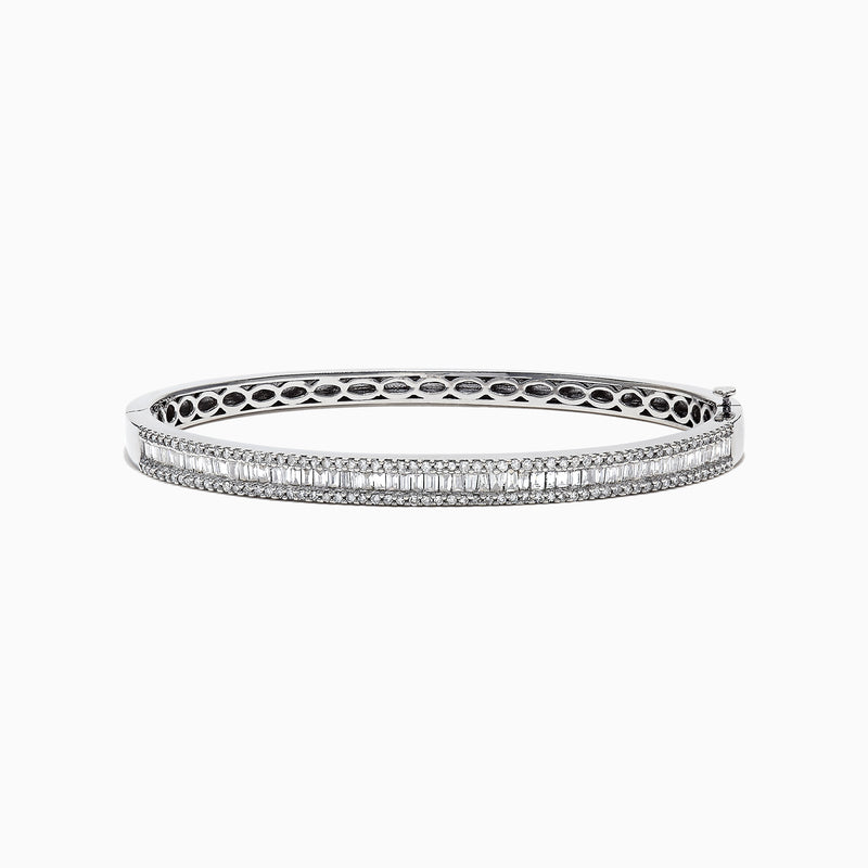 The Classique 14K White Gold Diamond Bangle 1.22 TCW features two rows of round diamonds, a central row of vertically set baguette-cut diamonds, and an openwork inner band design.