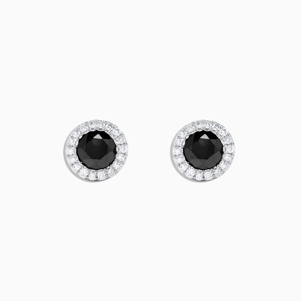 These 14K white gold stud earrings showcase a central black diamond surrounded by a halo of white diamonds, totaling 0.91 TCW for a timeless black and white design. Product: 14K White Gold Black and White Diamond Stud Earrings, 0.91 TCW.