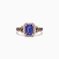 The Nahla Siri 14K Rose Gold Ring showcases a large emerald cut tanzanite center, framed by a diamond halo with additional diamonds along the band. Total carat weight is 1.72 TCW.
