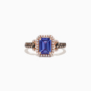 The Nahla Siri 14K Rose Gold Ring showcases a large emerald cut tanzanite center, framed by a diamond halo with additional diamonds along the band. Total carat weight is 1.72 TCW.