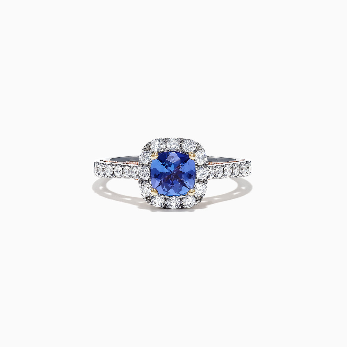 The Nahla Siri 14K Two Tone Gold Tanzanite & Diamond Ring, 1.45 TCW, features a cushion-cut tanzanite center surrounded by a diamond halo and more diamonds set along the band.