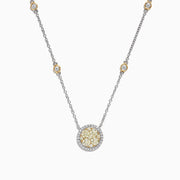 The Canare 14K Two-Tone Gold Yellow and White Diamond Station Necklace features a round pendant with clustered yellow and clear stones and yellow-accented settings along the chain.