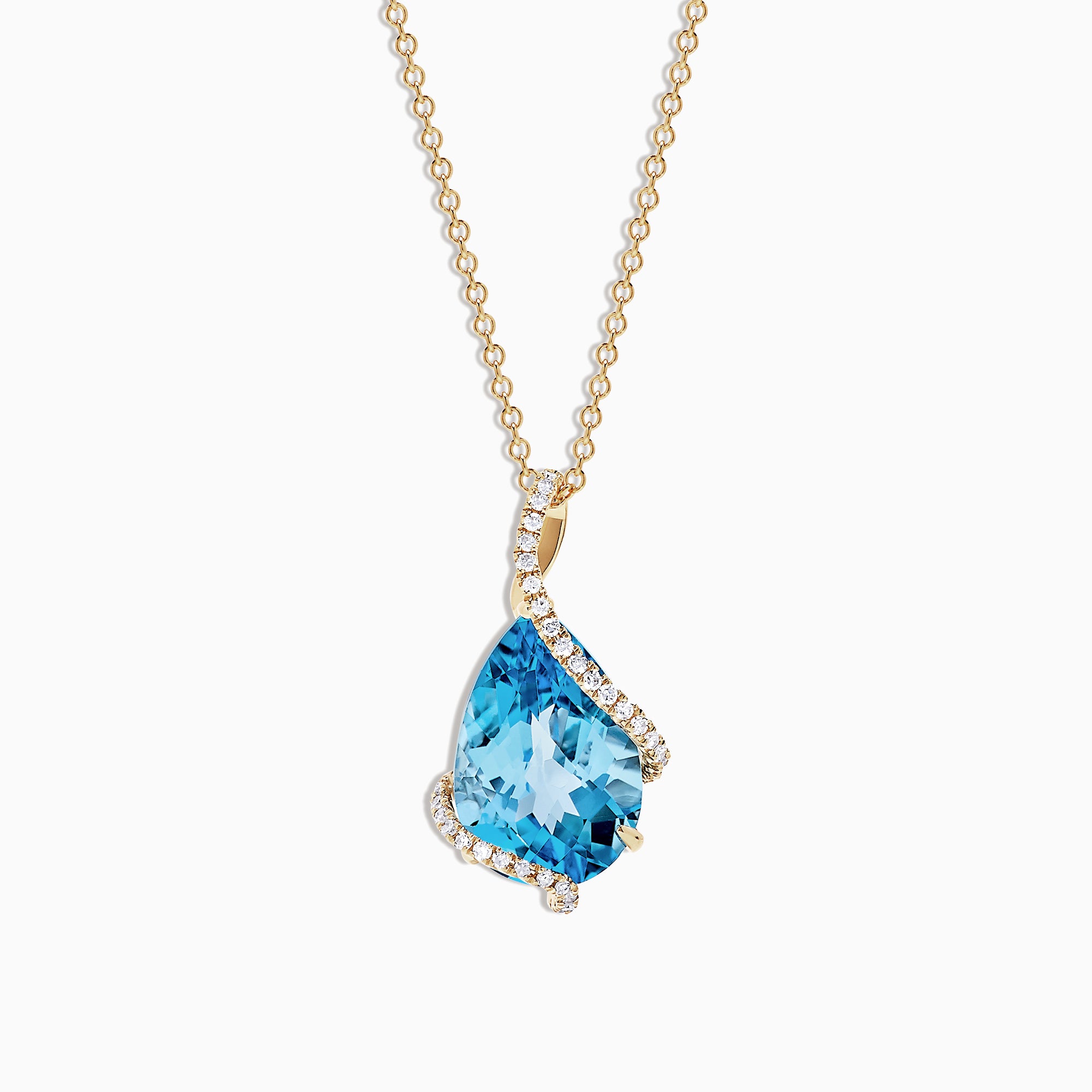 The Ocean Bleu 14K Yellow Gold Pendant features a 6.09 TCW blue topaz framed by sparkling diamonds in an asymmetrical design on a yellow gold chain, set against a white background.