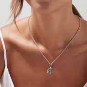 The Safari Sterling Silver Black Diamond Giraffe Pendant (0.13 TCW) features black spots, a green eye, and a gold-accented tail—part of the Effy Safari collection.