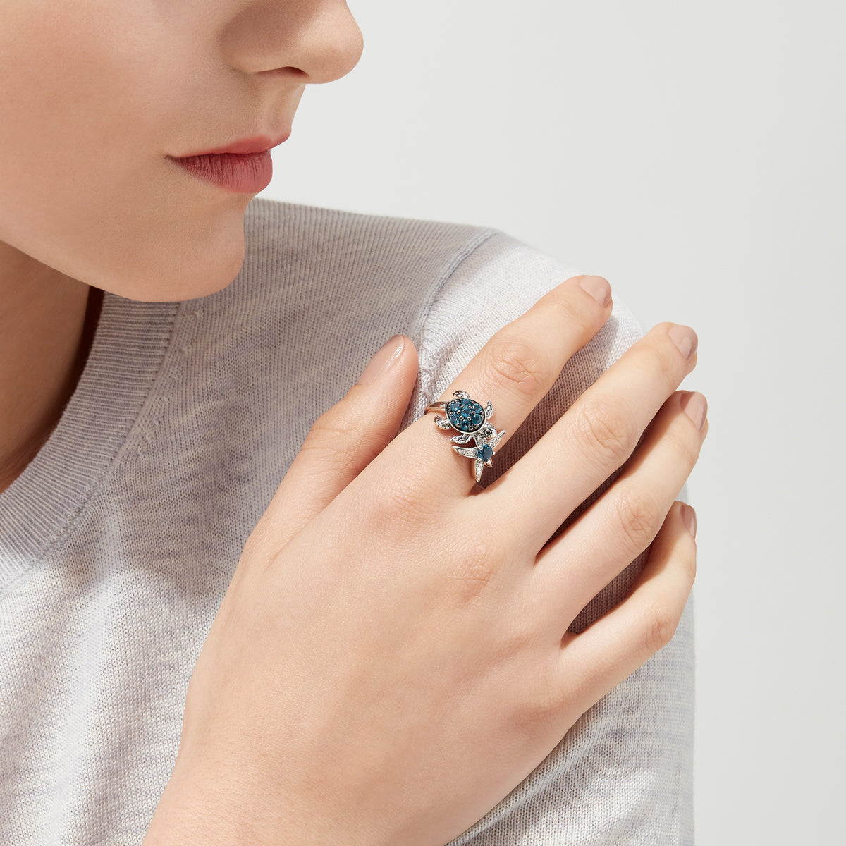 Seaside S. Silver Topaz & Diamond Turtle and Starfish Ring, 1.06 TCW, features blue gemstones and sparkling clear stones on turtle and starfish motifs, shown on a white background.
