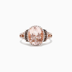 The 14K Rose Gold Morganite and Diamond Ring, 3.42 TCW, showcases a striking oval morganite center stone encircled by a double halo of white and black diamonds, with additional sparkling diamonds on the split shank.