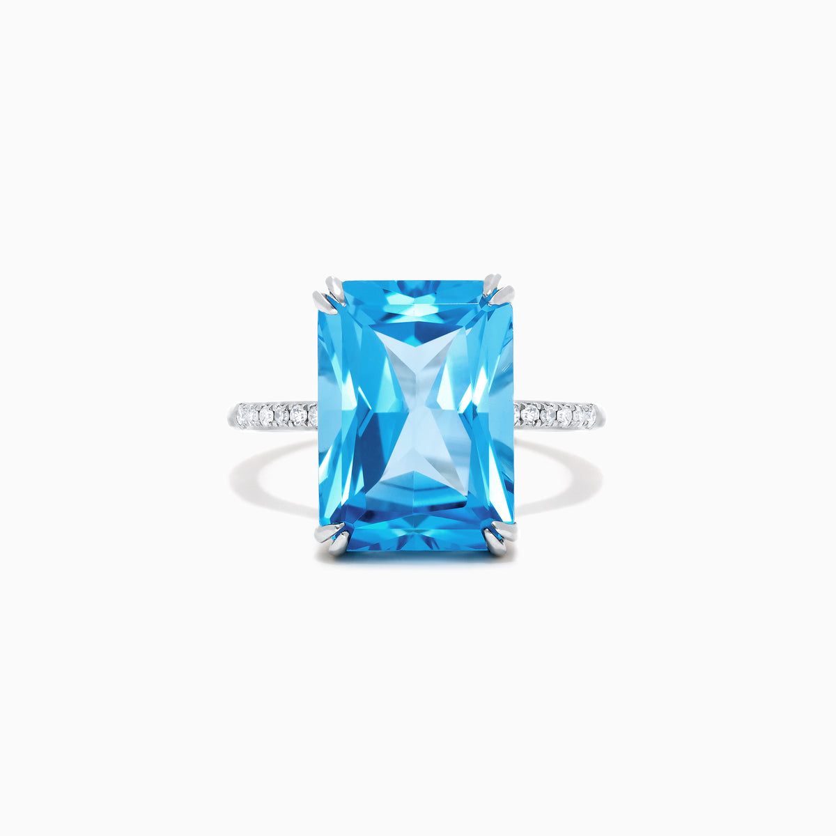 The Ocean Bleu 14K White Gold Blue Topaz and Diamond Ring, 8.06 TCW, showcases a large rectangular blue topaz center with sparkling diamonds along the band, displayed on a plain white background.