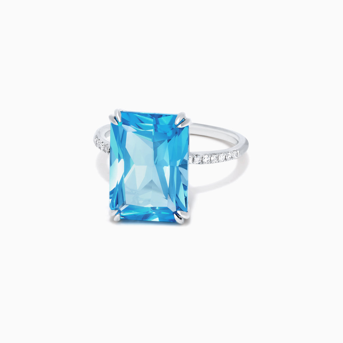 The Ocean Bleu 14K White Gold Blue Topaz and Diamond Ring, 8.06 TCW, showcases a large rectangular blue topaz center with sparkling diamonds along the band, displayed on a plain white background.